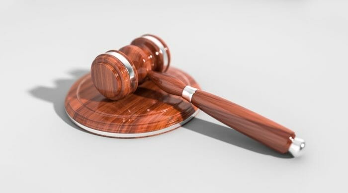 A gavel rests on a table.