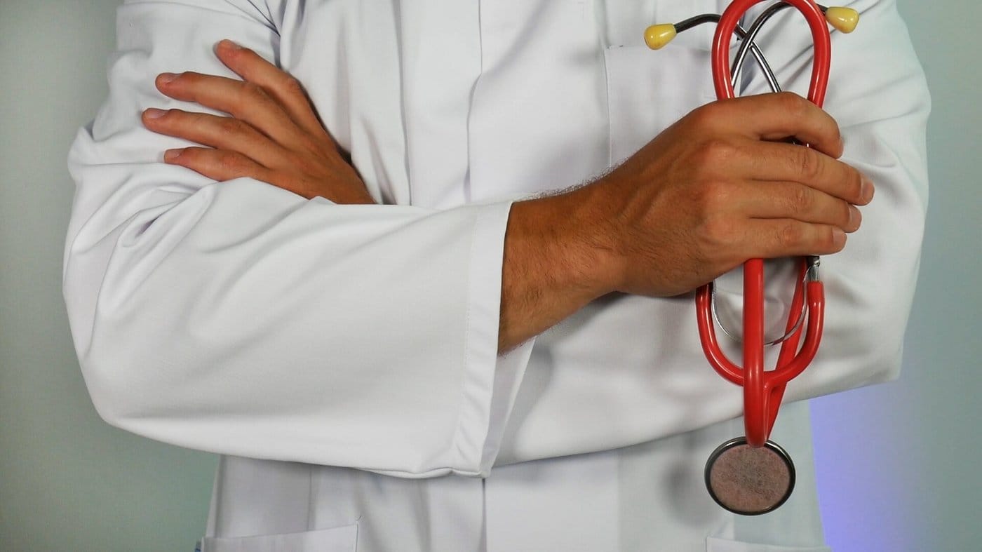 Doctor holds stethoscope.