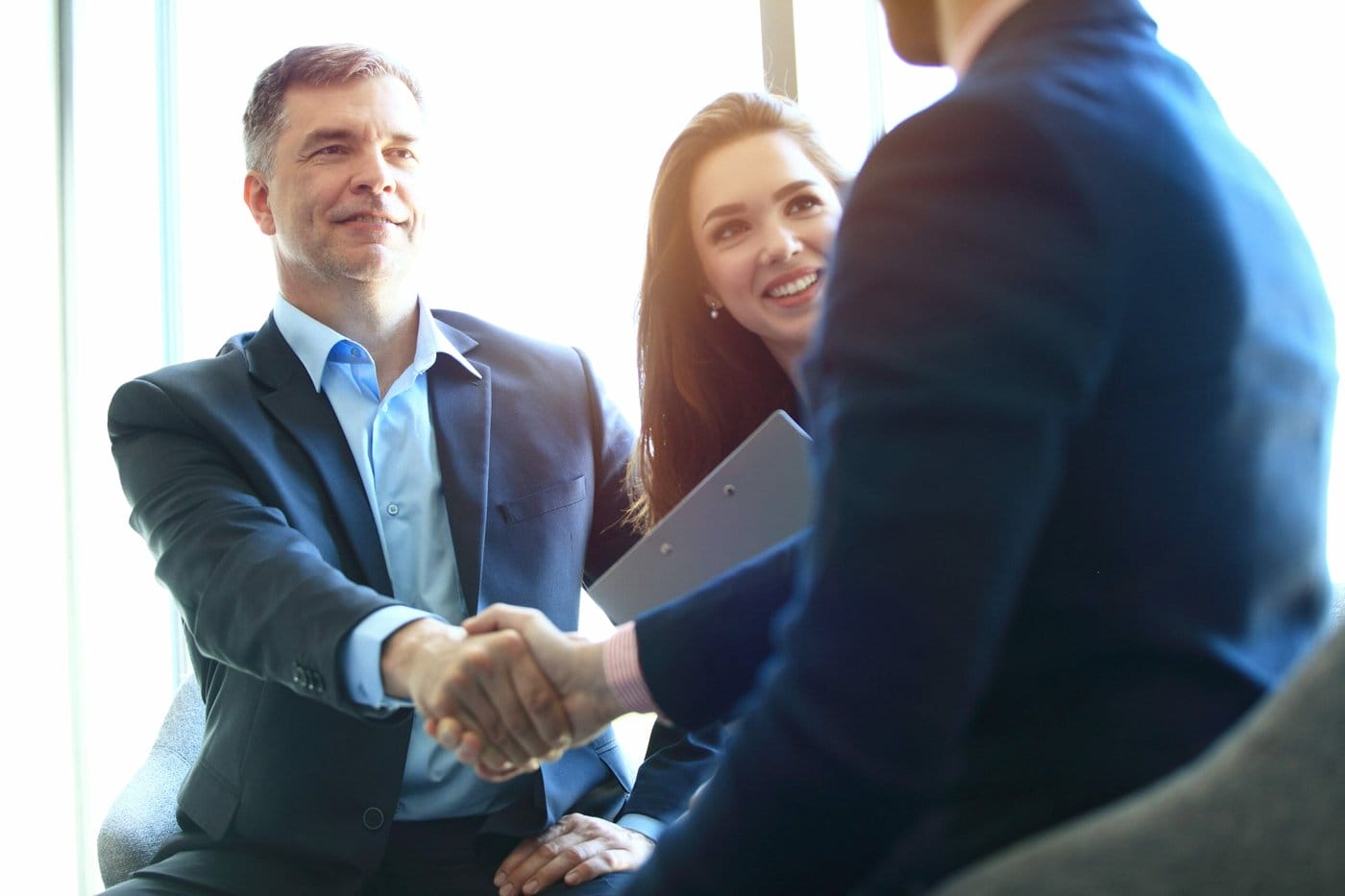 A couple meet with a banker. 