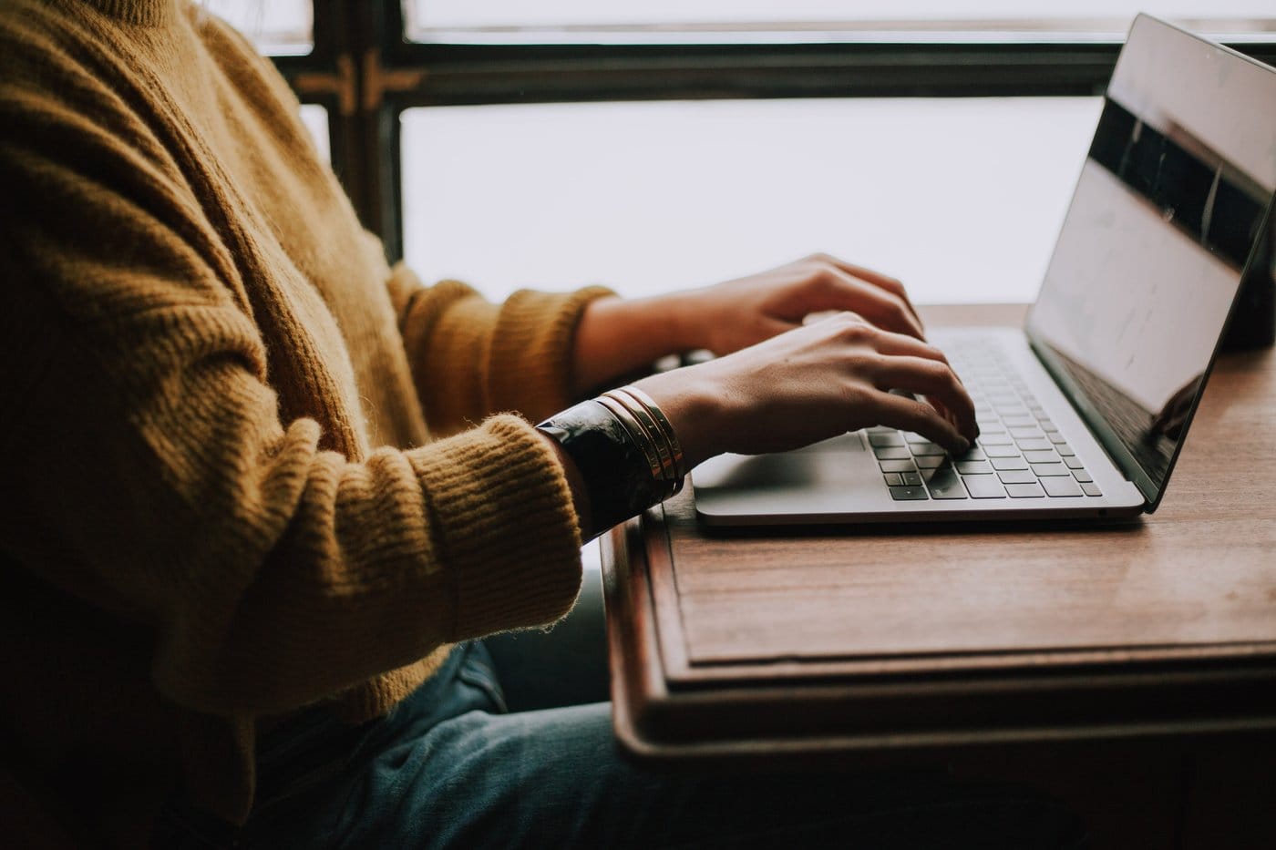 Person typing on a computer. 