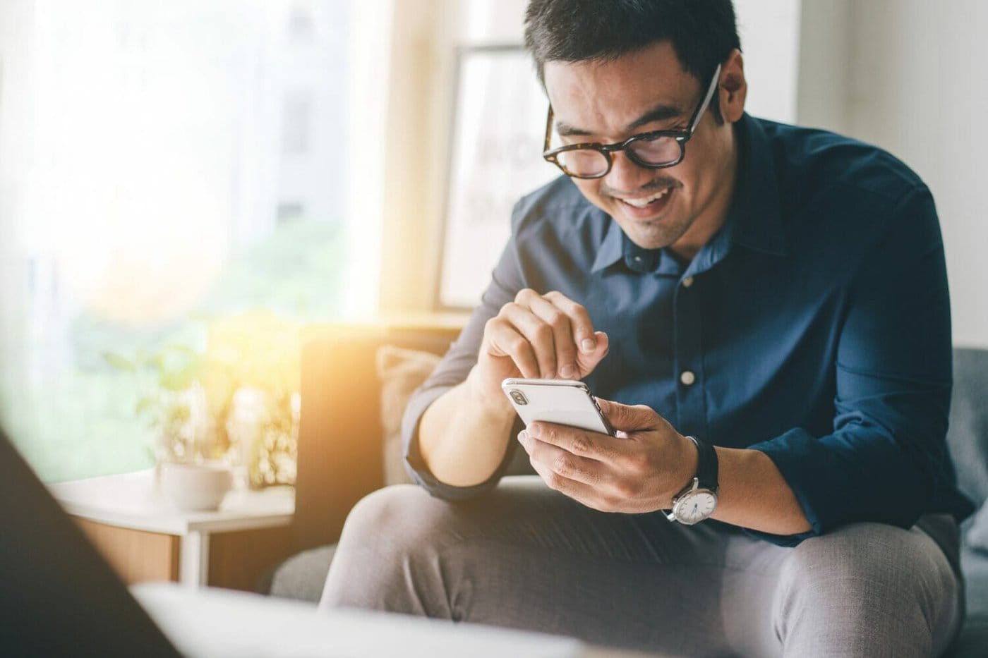 An immigrant looks for work using an app.