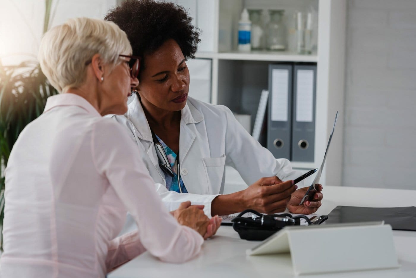 An immigrant talking with her doctor