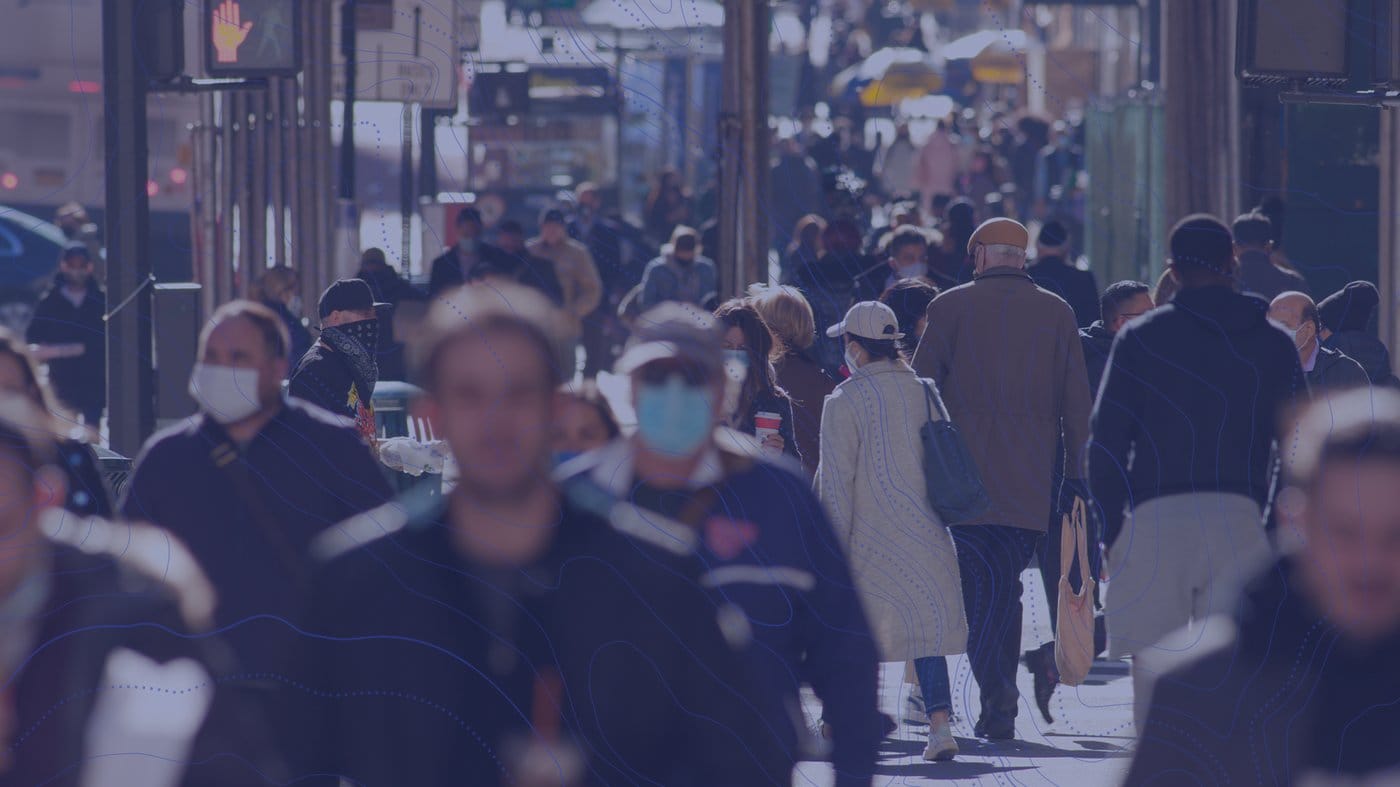 Immigrants walking on street during COVID-19 pandemic.