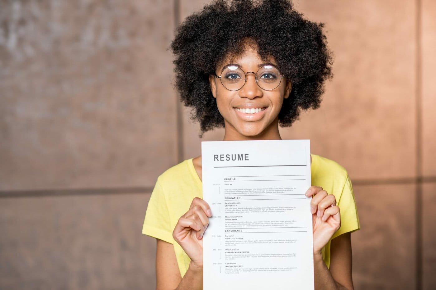 A new immigrant holds her reume