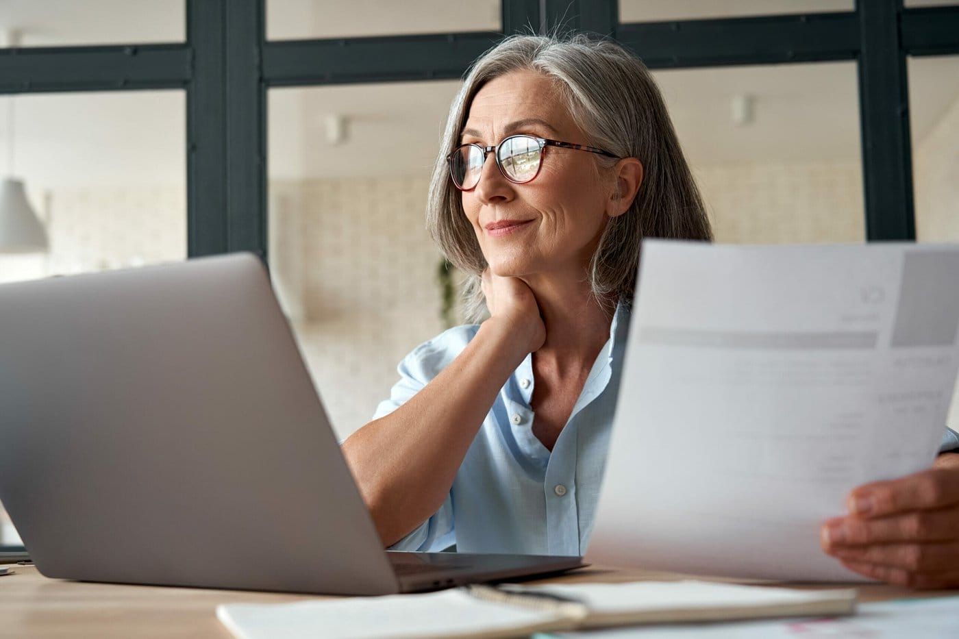 An immigrant works on her resume