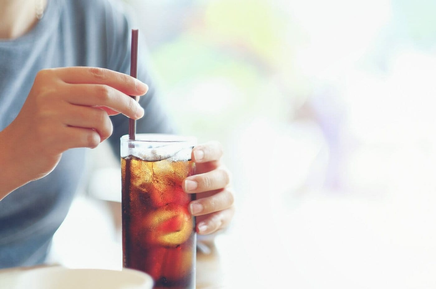 Immigrant drinks a soda