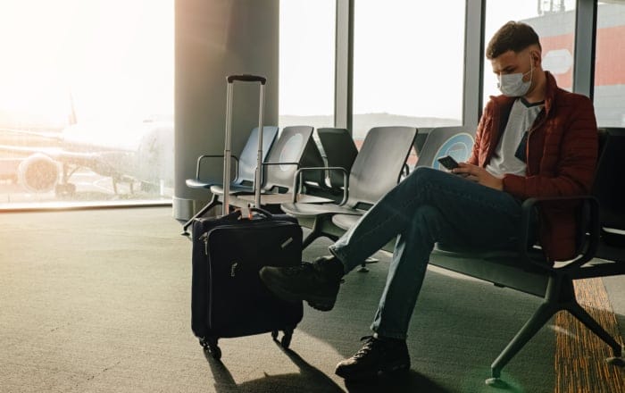 Traveler with covid mask at the airport