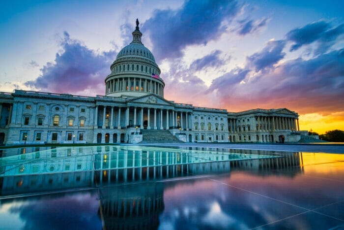 Sunset U.S. Capitol in Washington DC with the reflecting pool in foreground